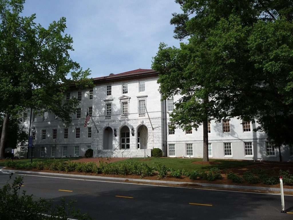 The Main Quad of Emory University’s primary Druid Hills campus, including the white facade of the Michael C. Carlos Museum, is featured.